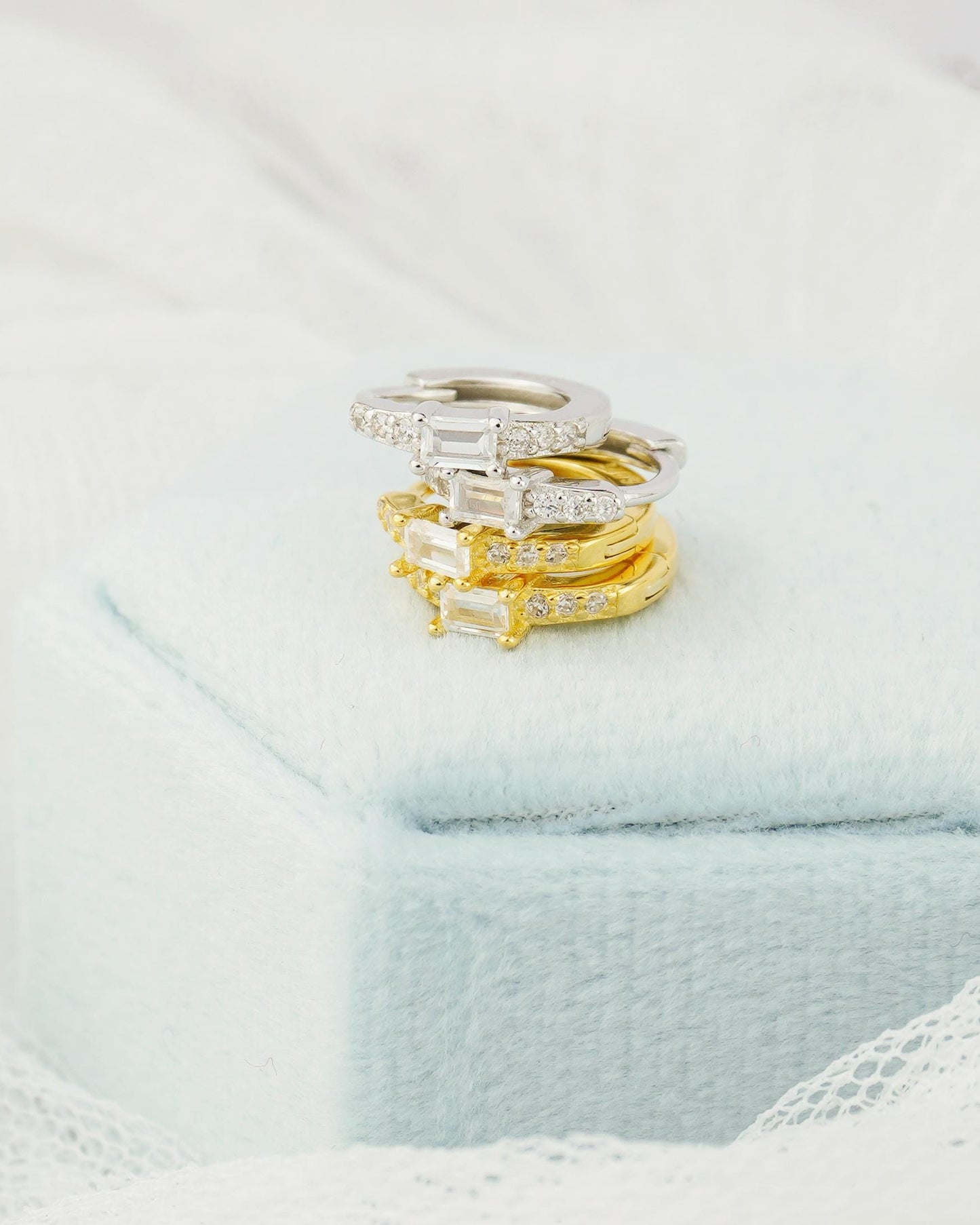 Pair of Paved Huggie Hoop Earrings in Sterling Silver or Plated Gold, Baguette CZ Stone