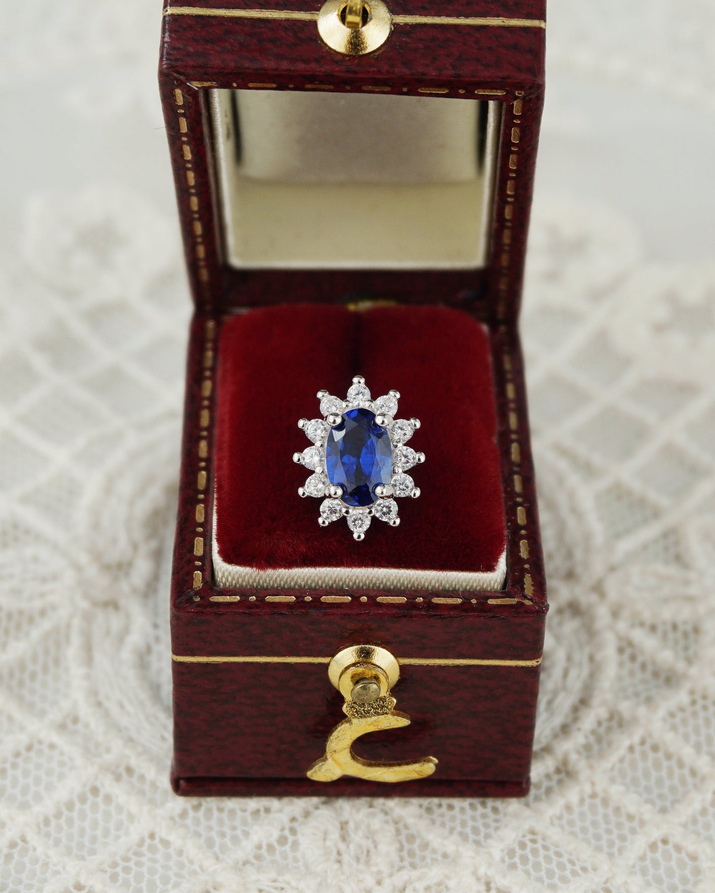 Pair of Halo Oval Sapphire Blue CZ Stud Earrings in Rhodium Plated over Sterling Silver