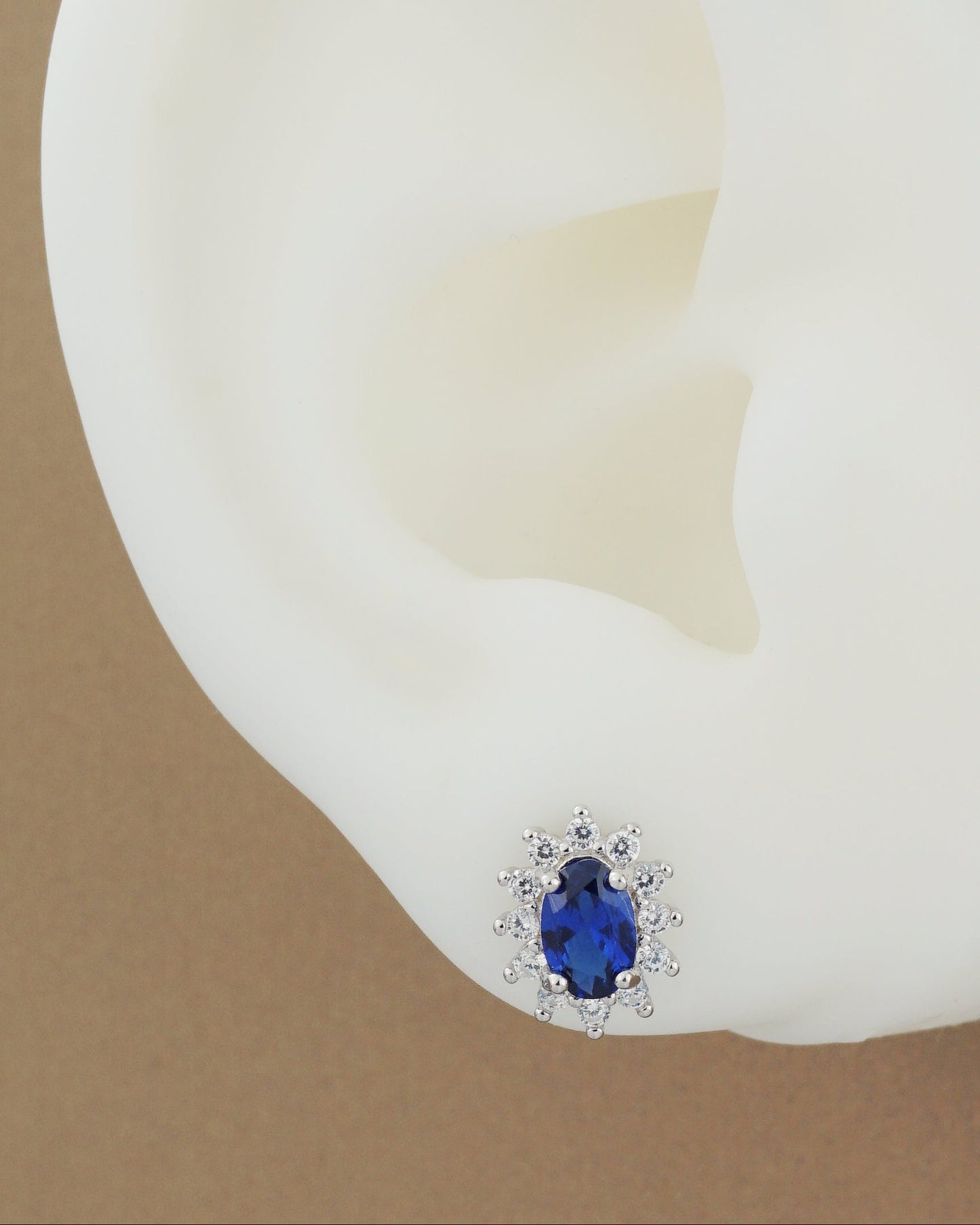 Pair of Halo Oval Sapphire Blue CZ Stud Earrings in Rhodium Plated over Sterling Silver