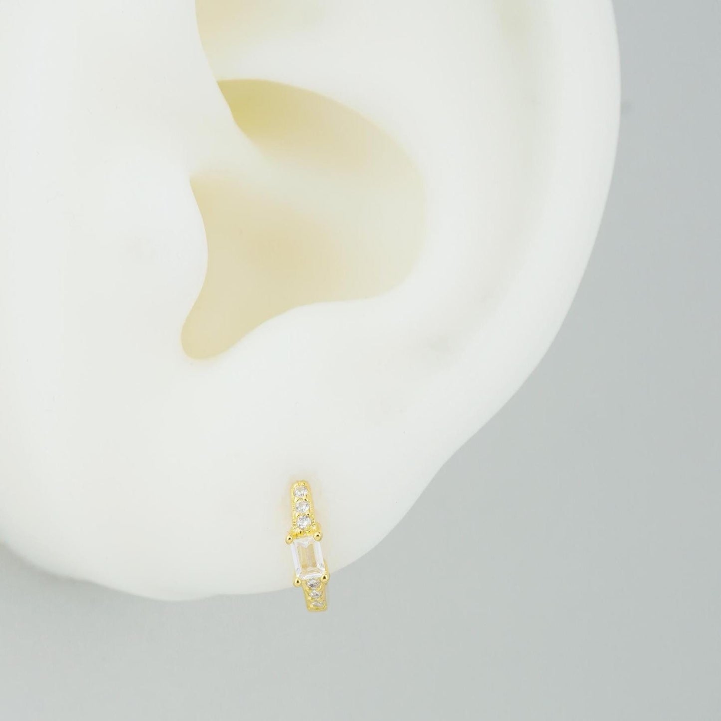 Pair of Paved Huggie Hoop Earrings in Sterling Silver or Plated Gold, Baguette CZ Stone