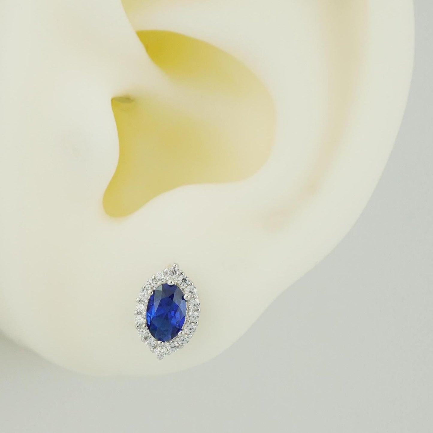 Pair of Marquise-shaped Stud Earrings Featuring a Central Blue Gemstone Surrounded by a Halo of CZ Accents, 14ct Gold Plated/Sterling Silver