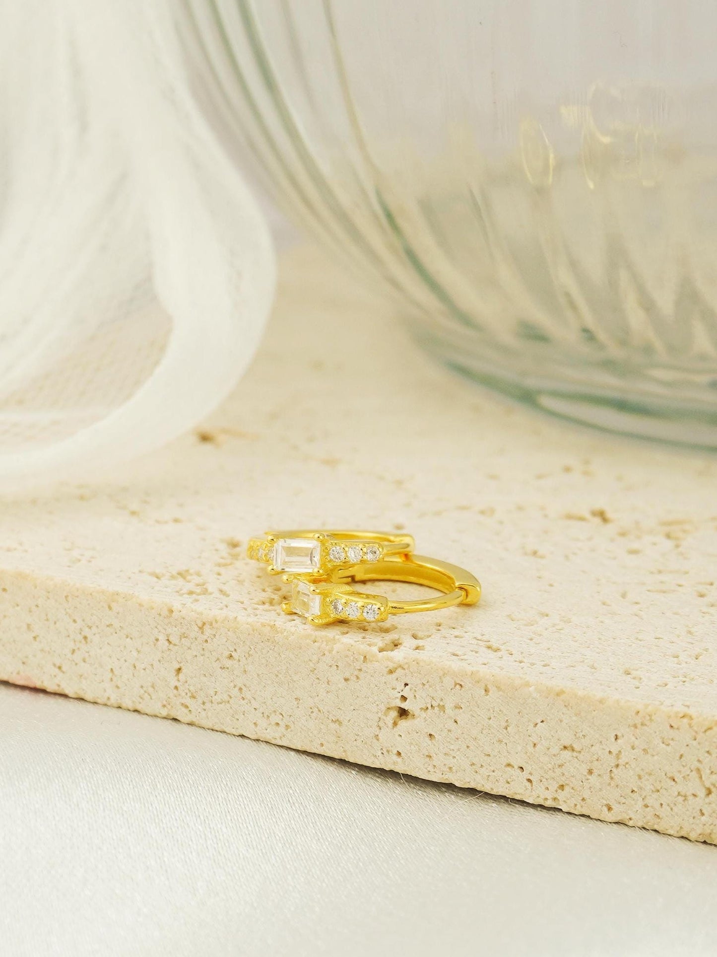 Pair of Paved Huggie Hoop Earrings in Sterling Silver or Plated Gold, Baguette CZ Stone