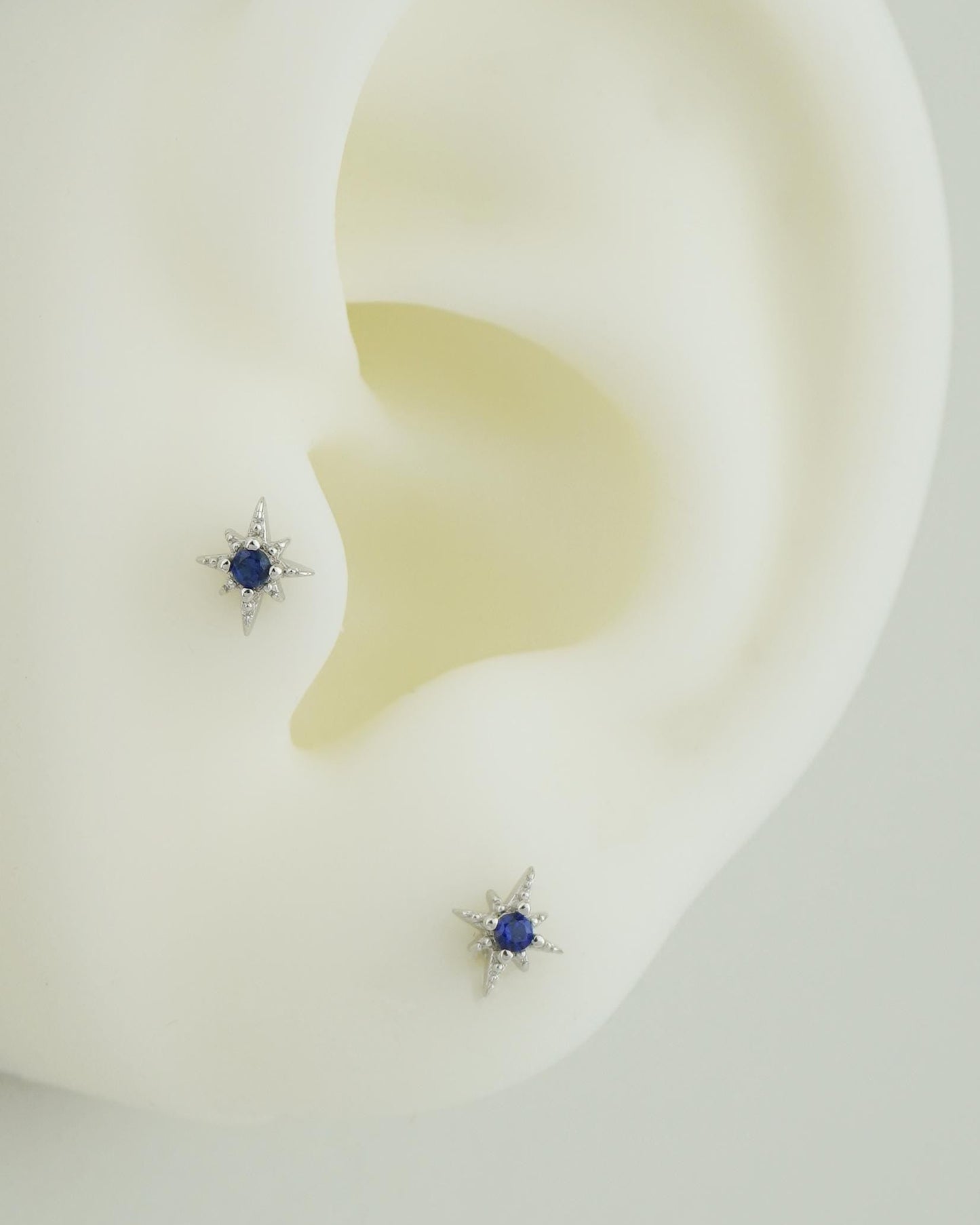 Pair of Tiny Sterling Silver Starburst Stud Earrings in Rhodium or Gold Plated, Celestial Star Burst Design with Blue CZ