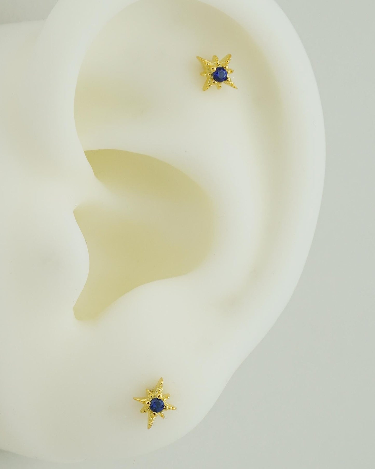 Pair of Tiny Sterling Silver Starburst Stud Earrings in Rhodium or Gold Plated, Celestial Star Burst Design with Blue CZ